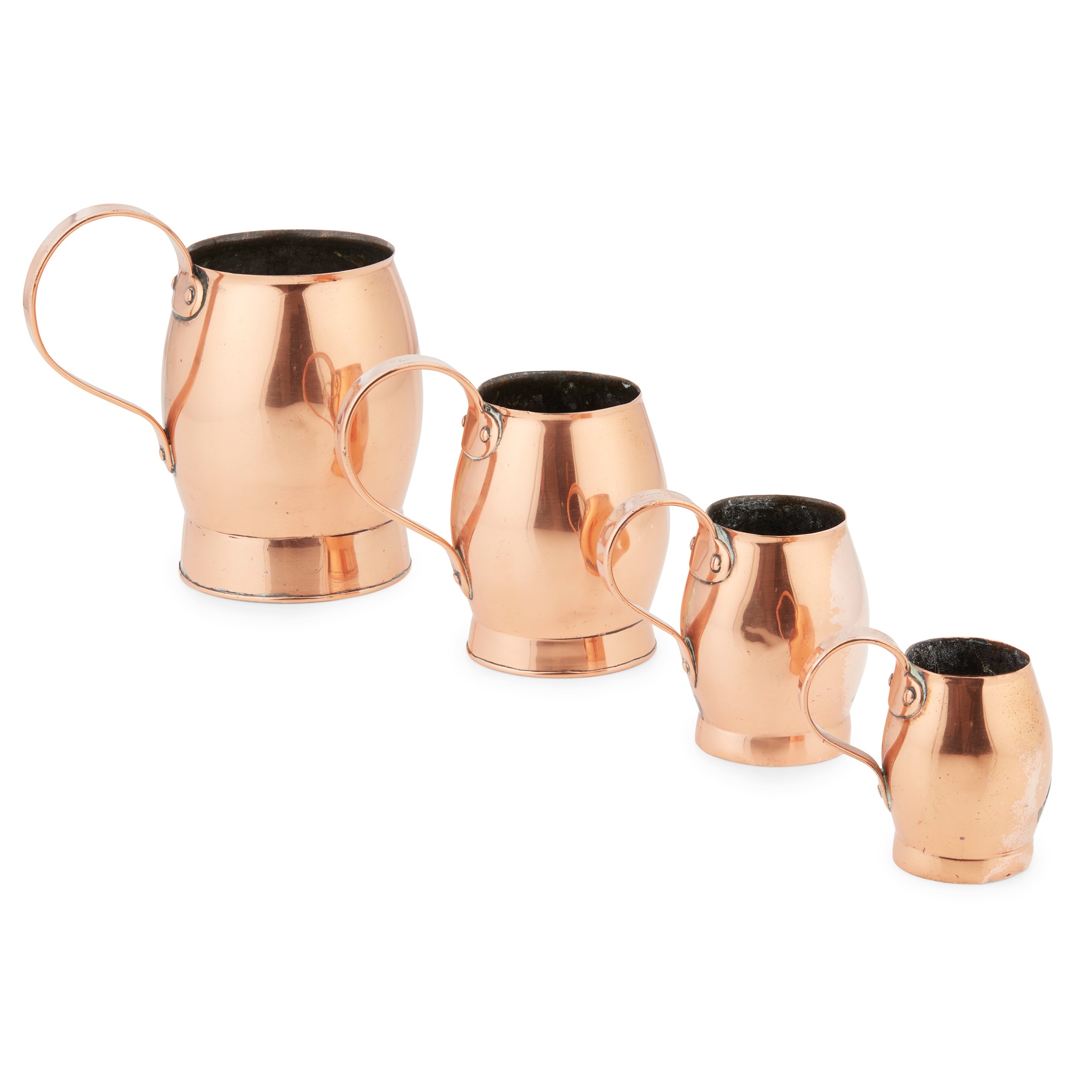 A SET OF FOUR COPPER MEASURING JUGS