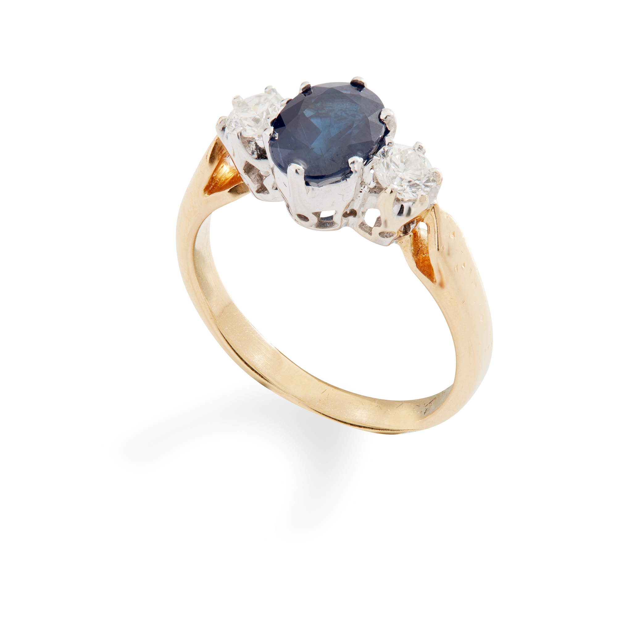 A sapphire and diamond three-stone ring