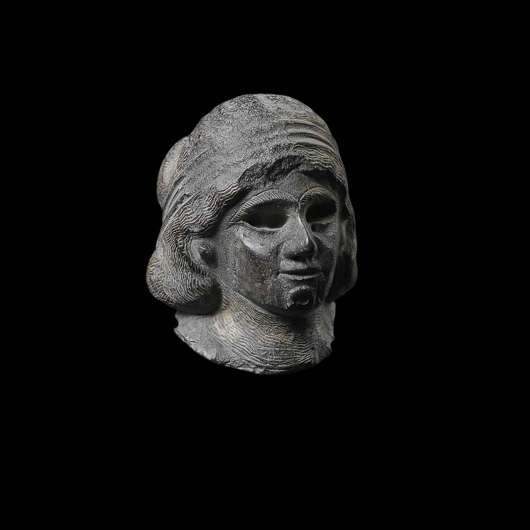 MESOPOTAMIAN HEAD OF A FEMALE WORSHIPPER
