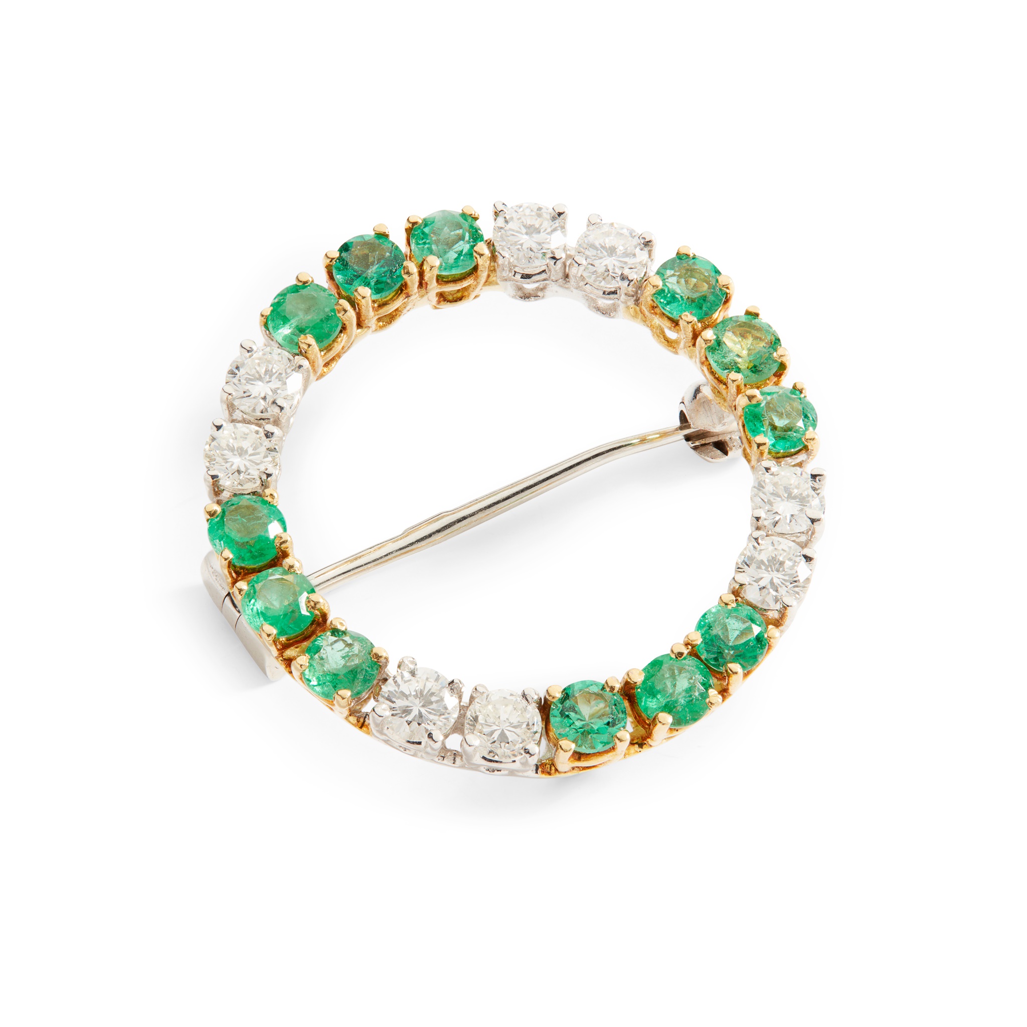 An emerald and diamond brooch