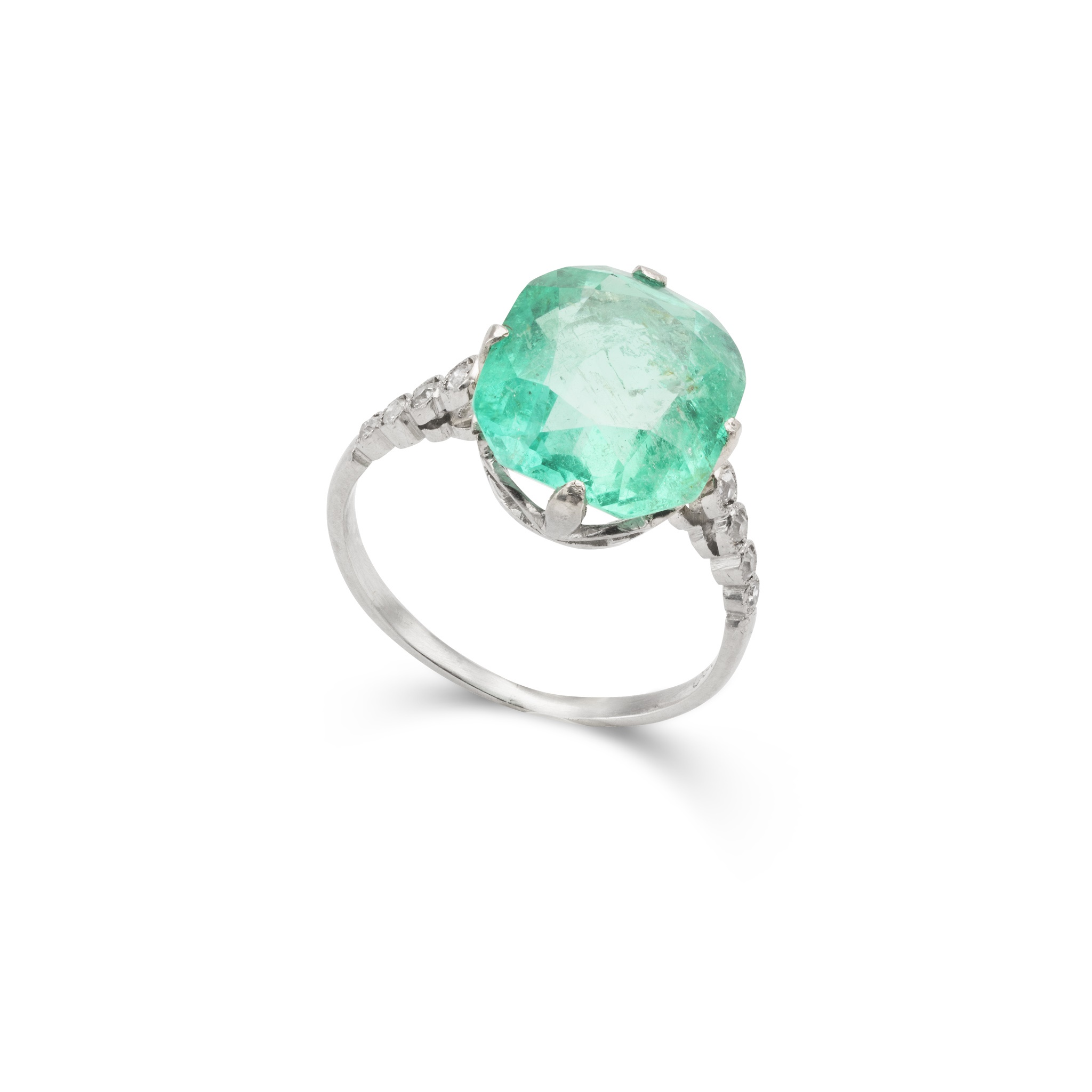 An emerald and diamond ring