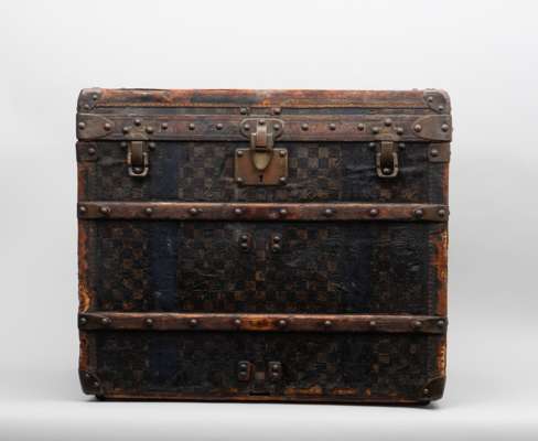 <p>'Louis Vuitton, antique travel trunk, designed c. 1915&ndash;1925. Wooden frame with brass fittings, locks, rivets and handles, bearing the brand&rsquo;s engraving. Interior with original fabric lining and maker&rsquo;s label. Sides personalised' 