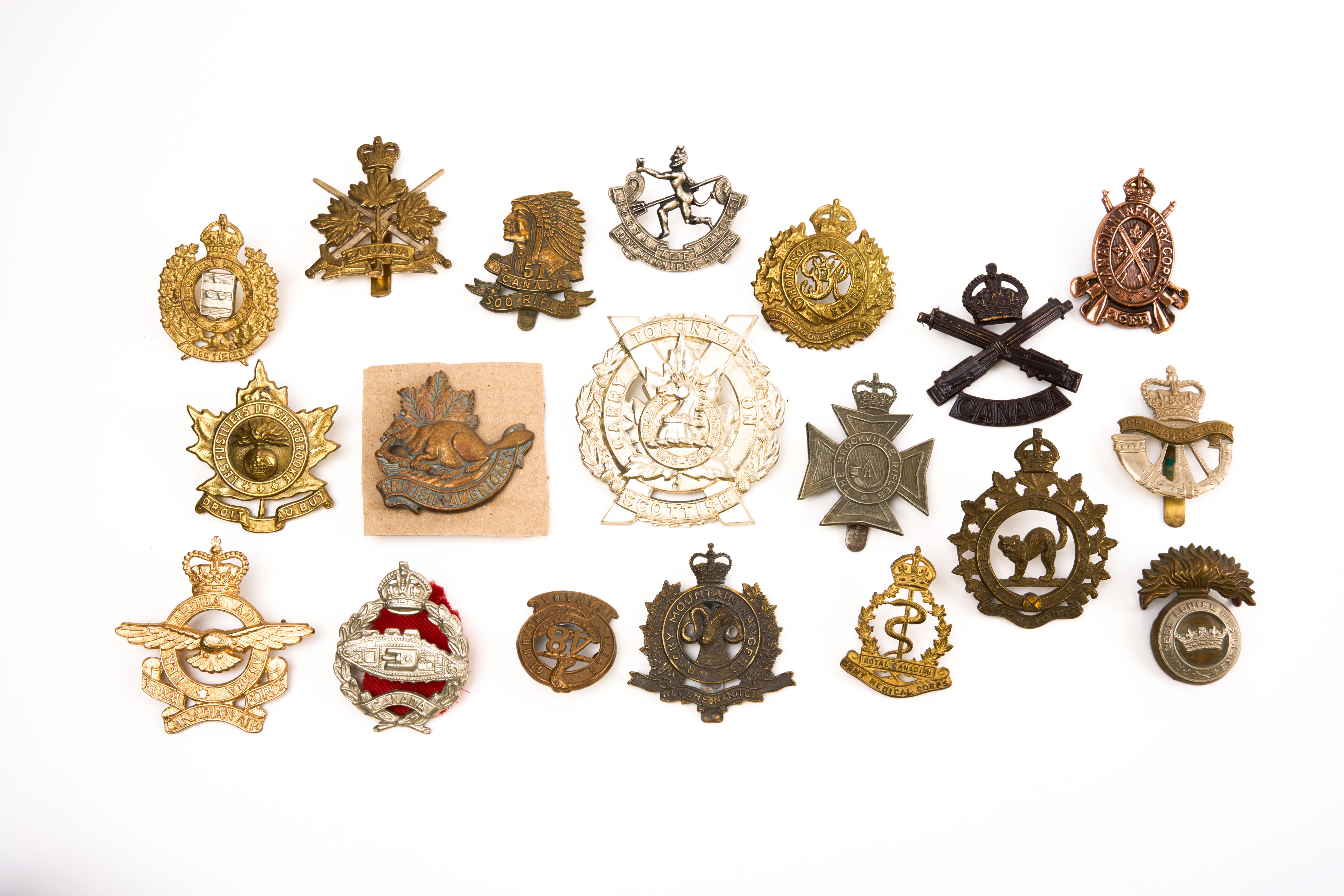 19 Canadian cap badges, loose in envelope