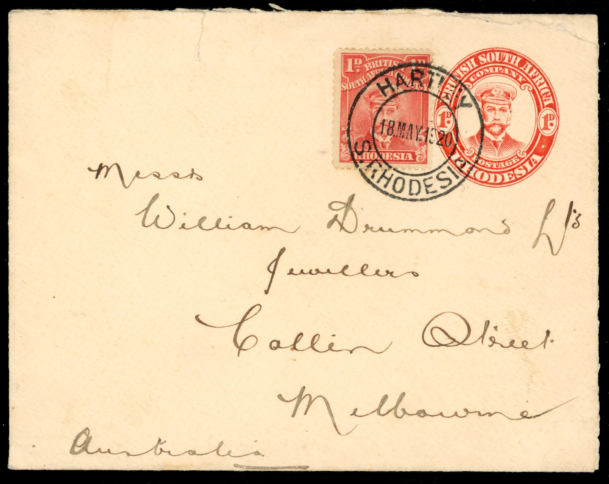 Rhodesia 1d postal stationery envelope uprated to Australia