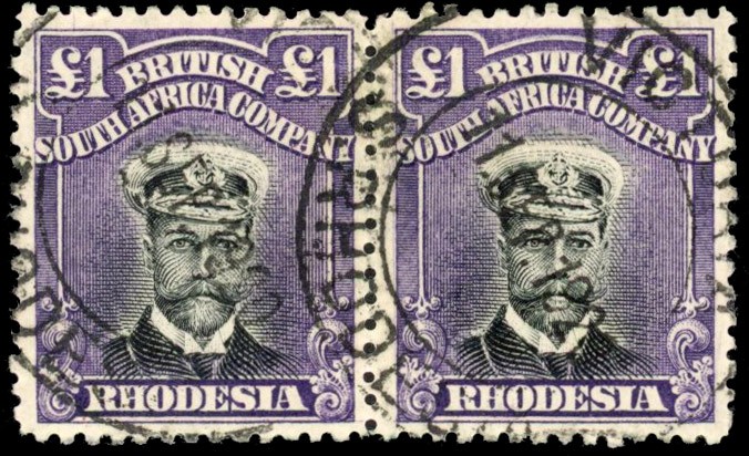 Rhodesia £1 SG 242 pair with cap flaws and hand-painting, used