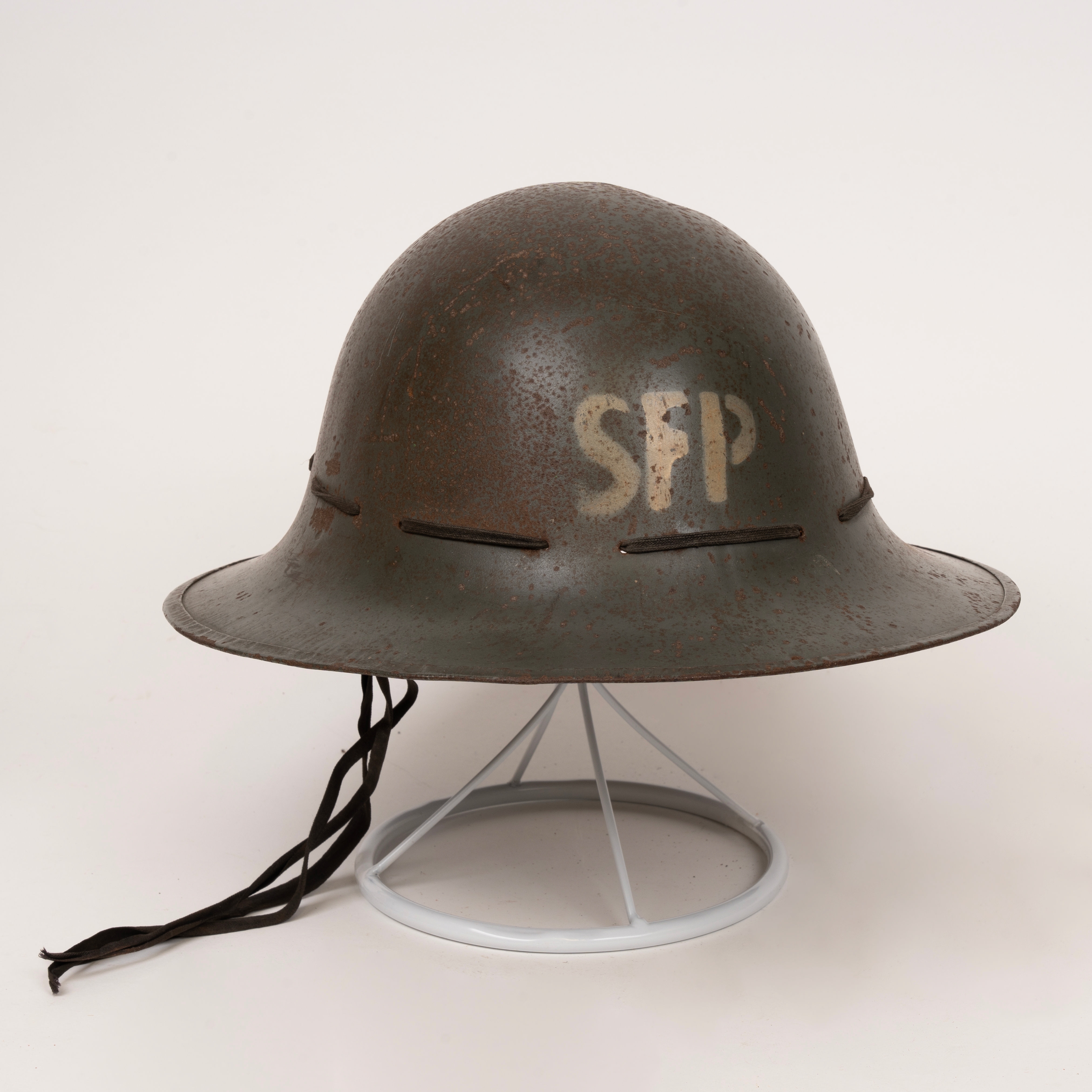 Three steel helmets, Home Front interest, two Zuckerman helmets, one National Fire Service