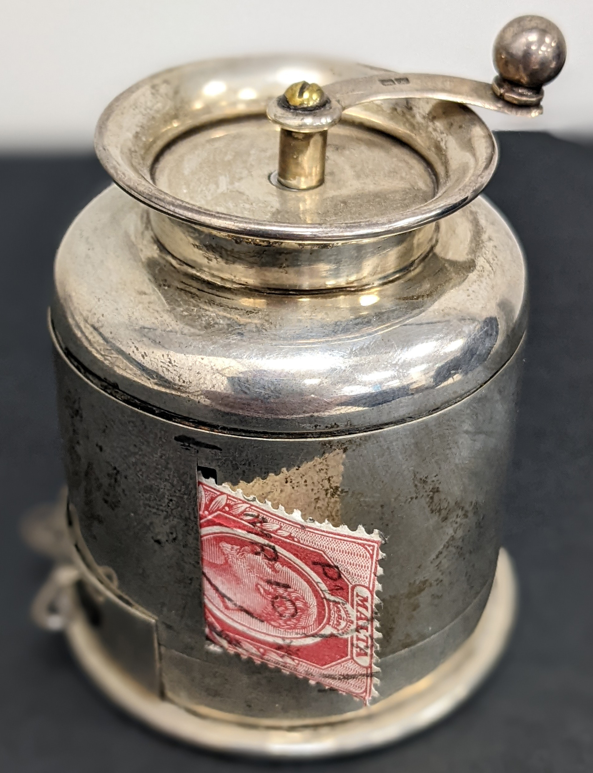 Ephemera: 1910 Chester, silver coil dispenser and moistener combined in the form of a milk churn by Grey & Co., the stamps...