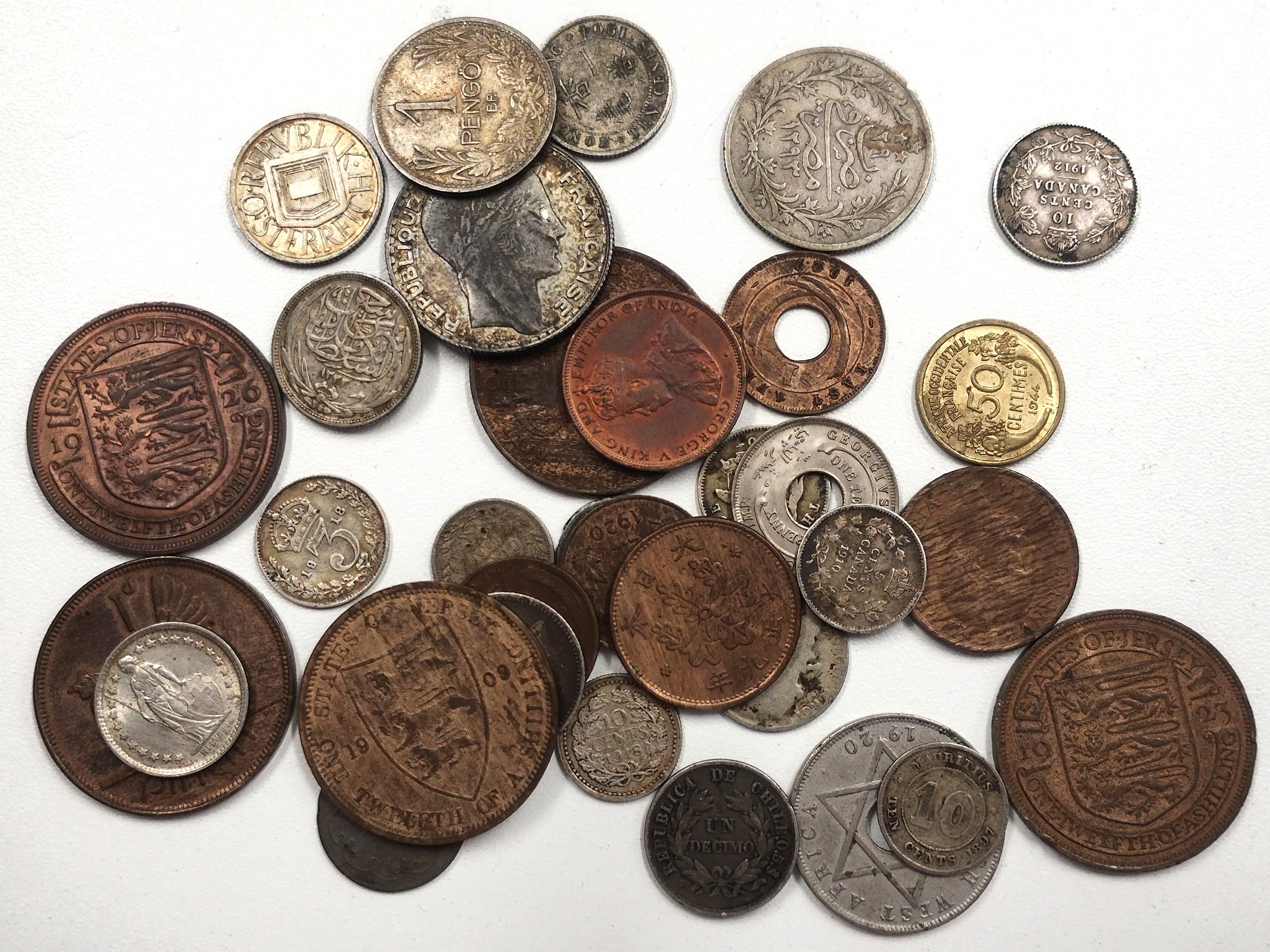 Mixed World coin lot of 33 pieces, various metals including silver.