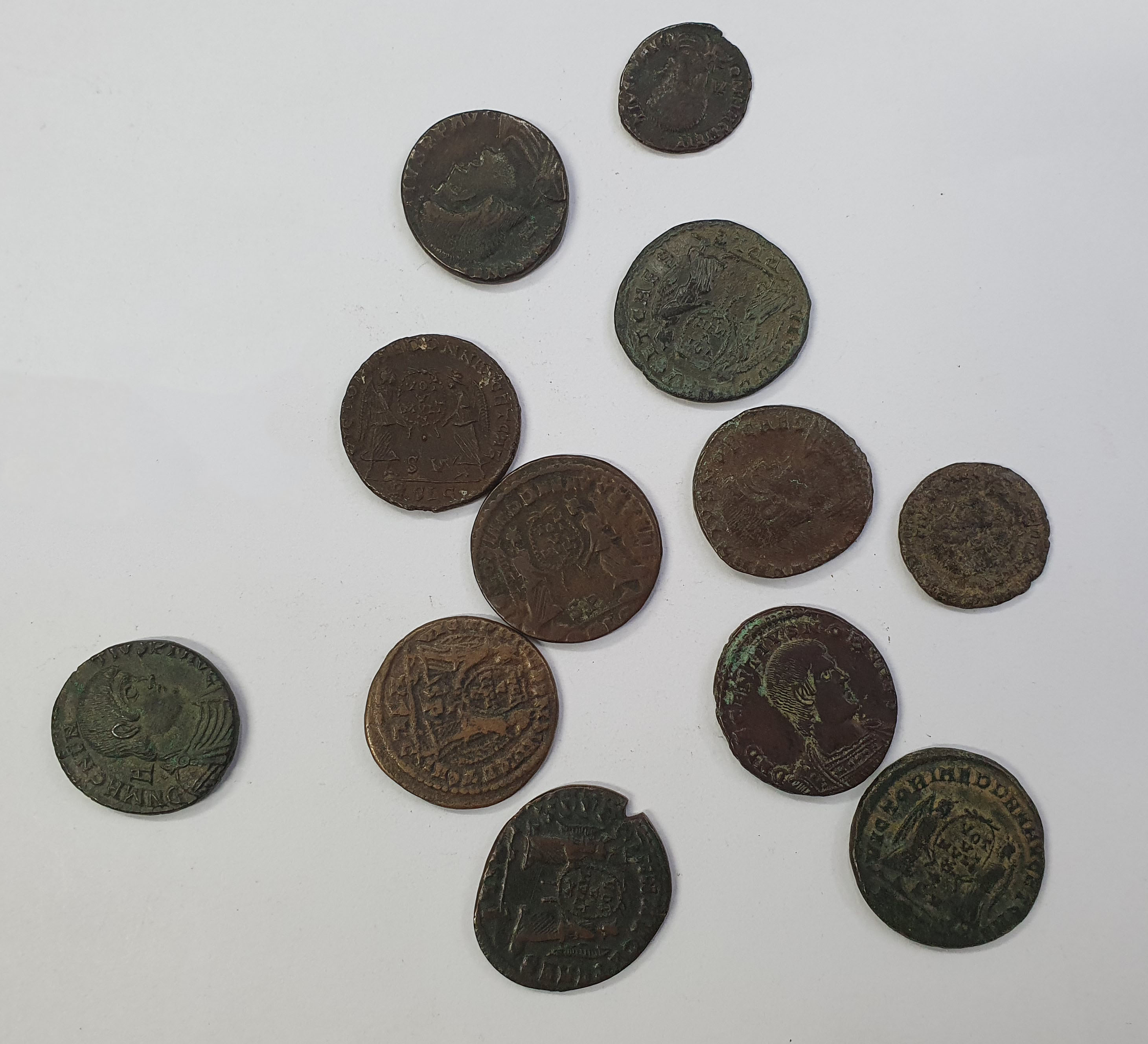Group of 12 Magnentius and Decentius AE Folles. Various mints.