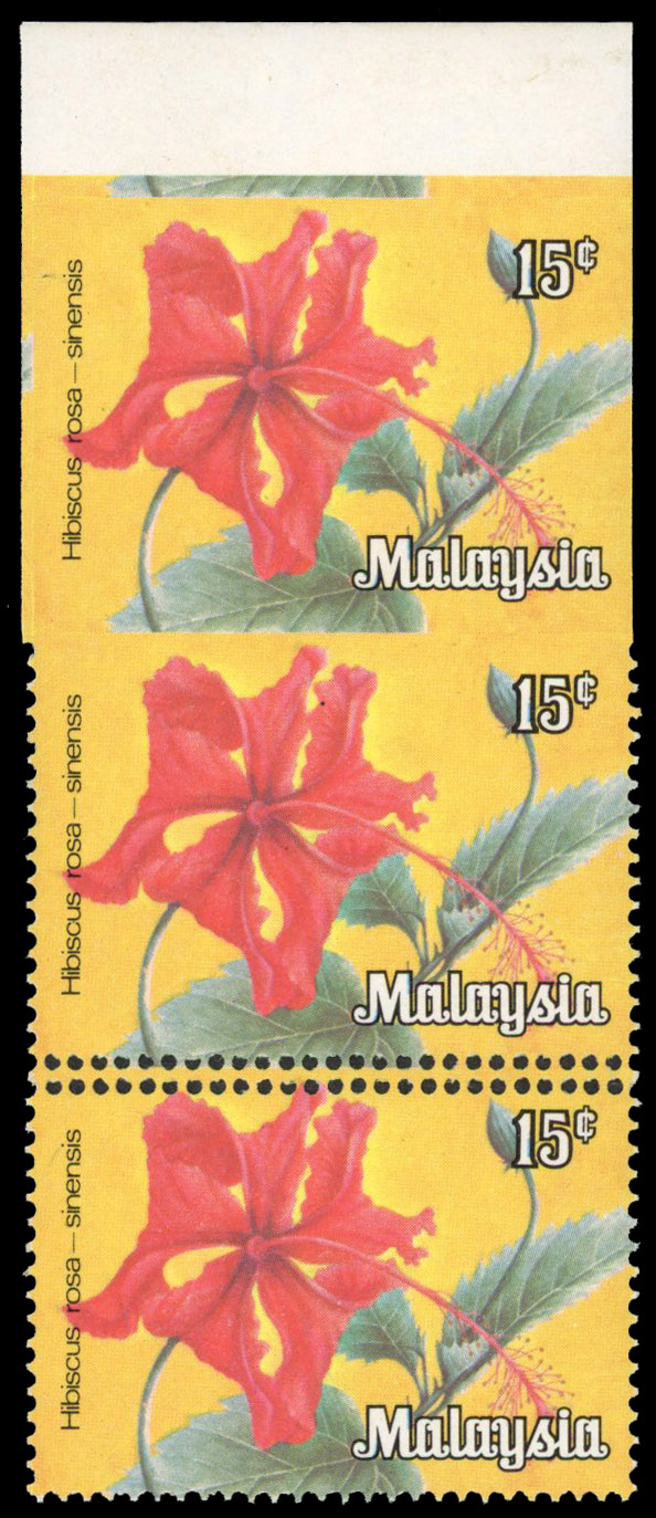 MALAYSIA: 1979 15c Hibiscus top marginal, vertical strip of 3, the upper stamps imperforate and doubly perforated between