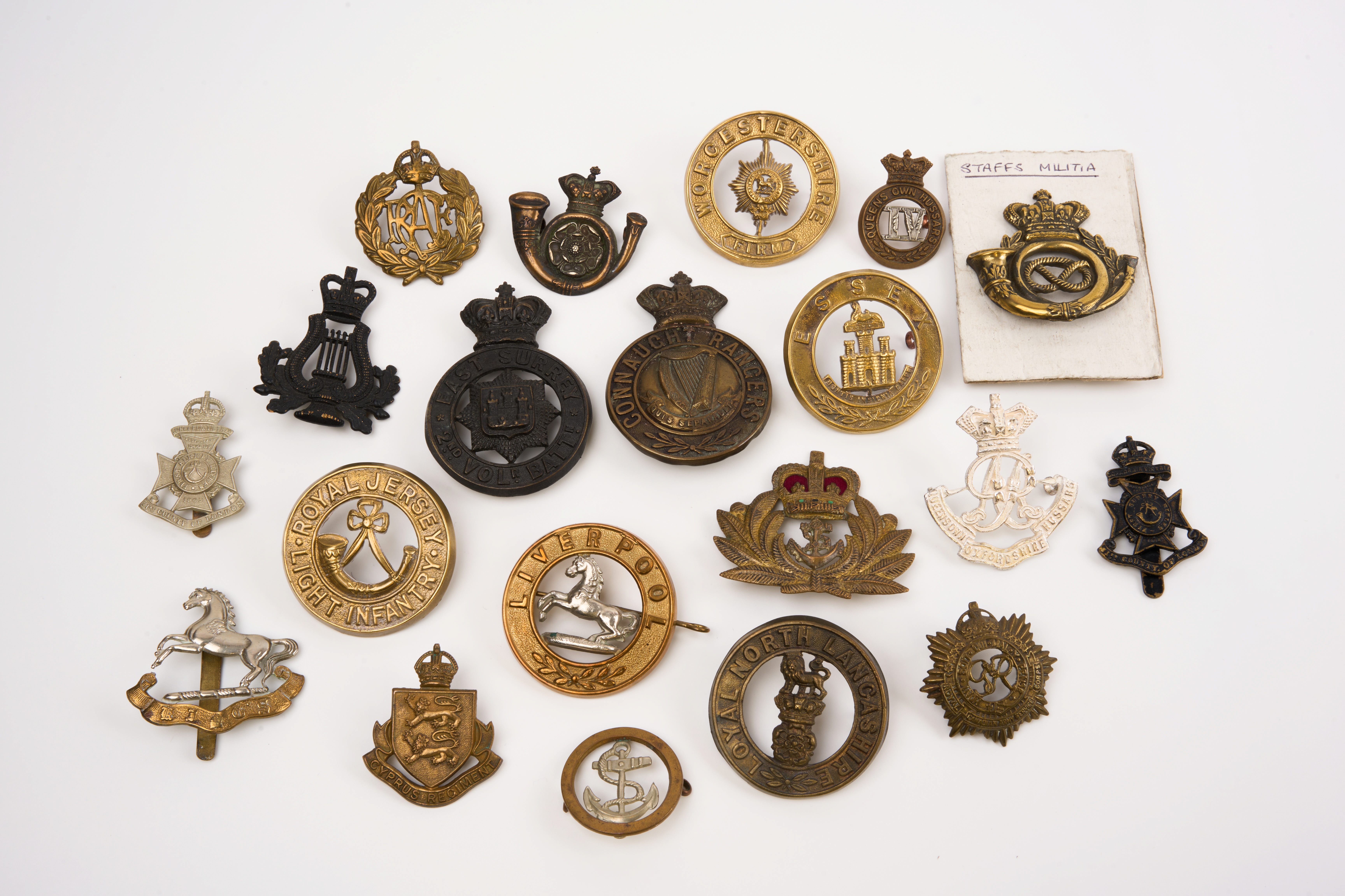 20 British and Commonwealth cap badges and Helmet plates, loose in envelope
