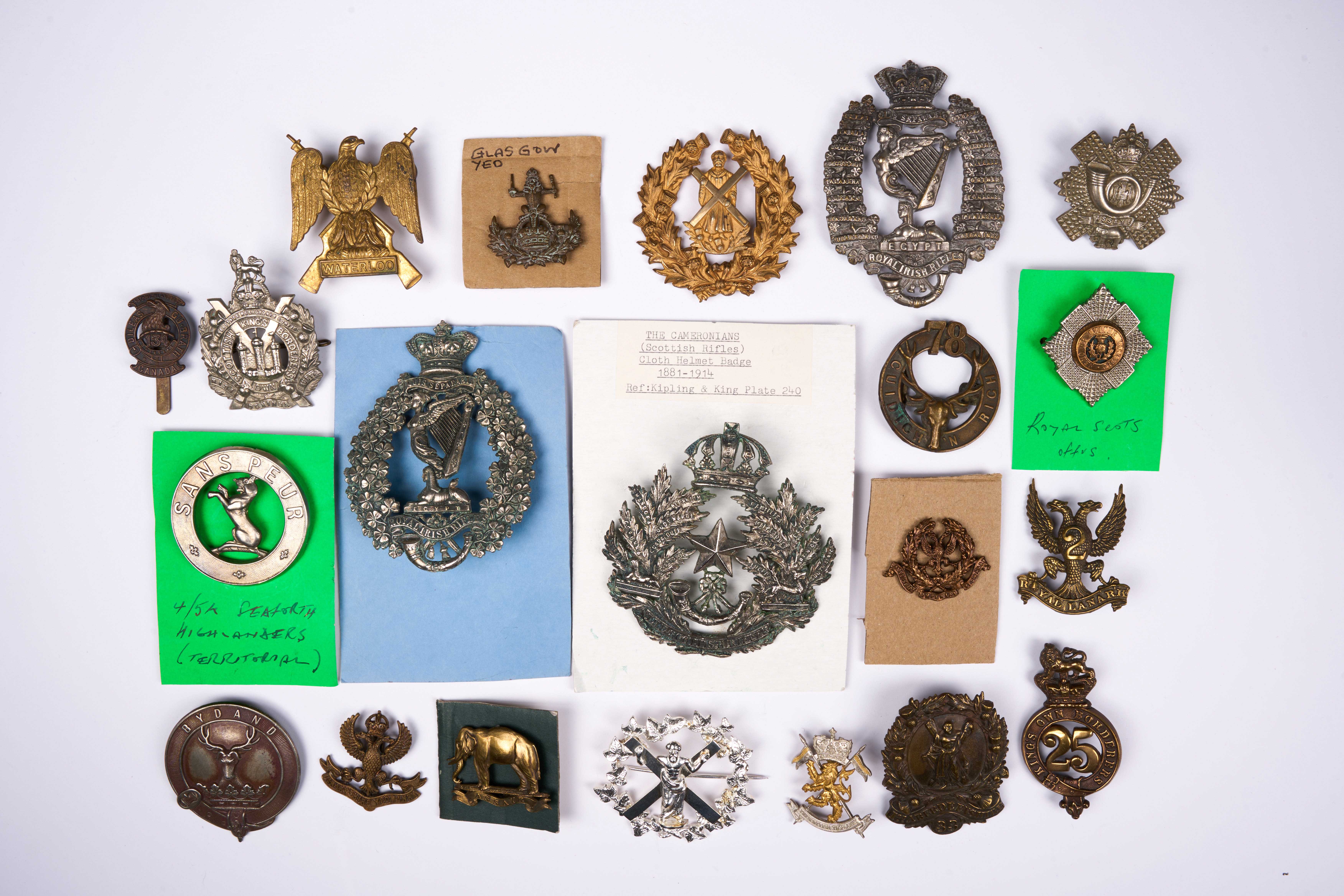 21 British and Commonwealth cap badges, loose in envelope