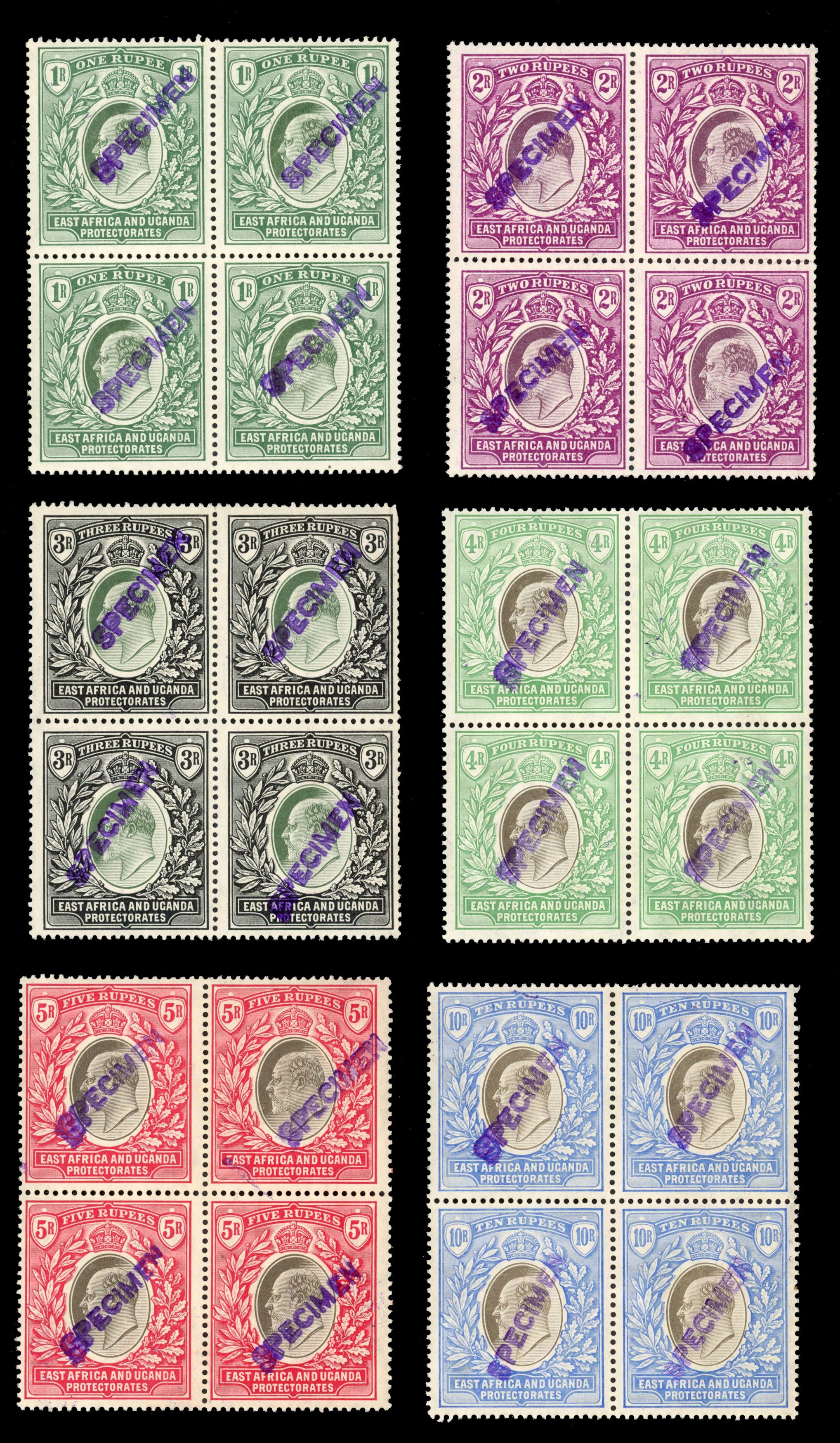 East Africa & Uganda SG 17-31 ½a - 10r blocks with local SPECIMEN overprints or handstamps
