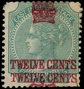 1867 12c on India 4a green mint example with surcharge double.  Small part o.g. with a crude hinge repair to a cut at lower...