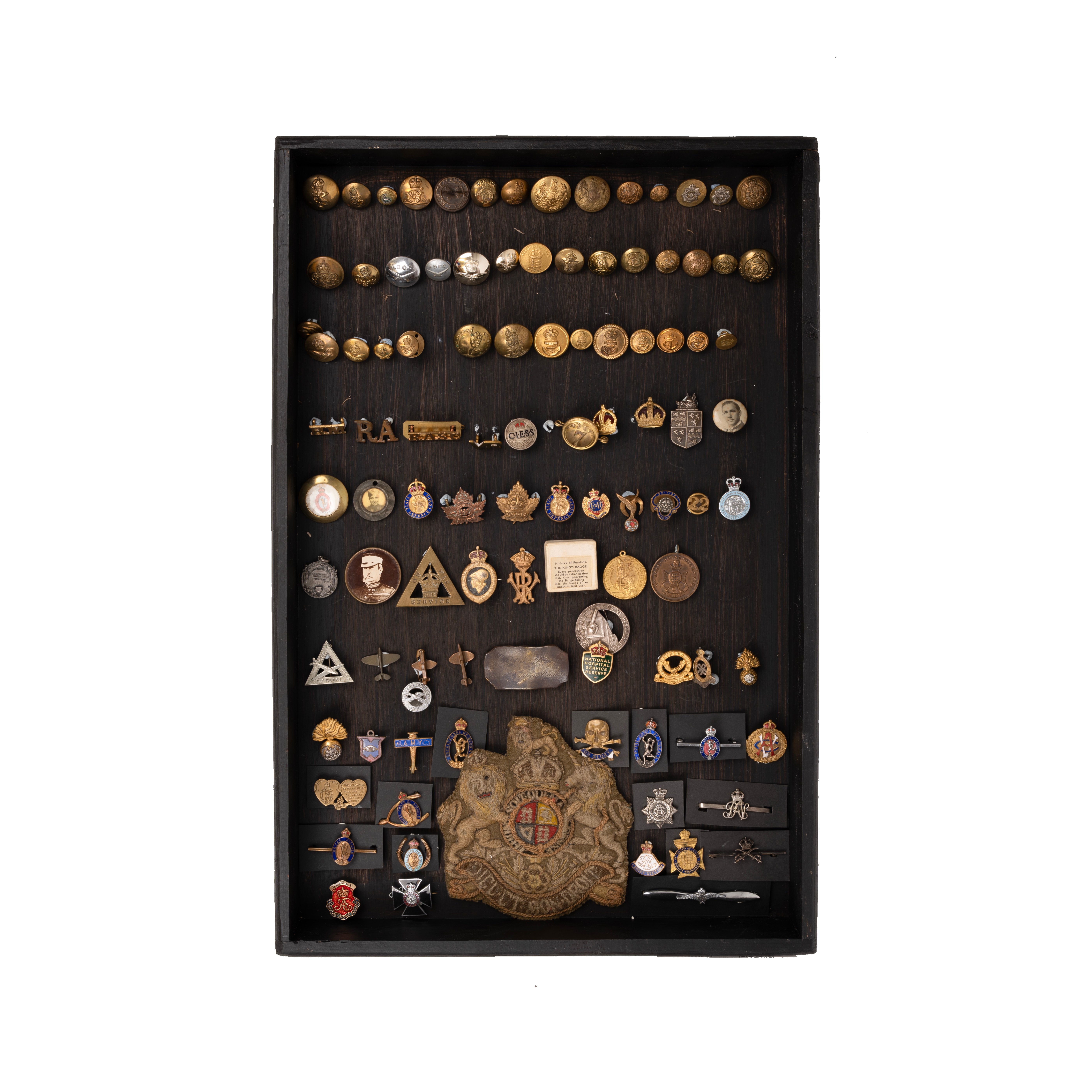 Buttons and badges housed in display box