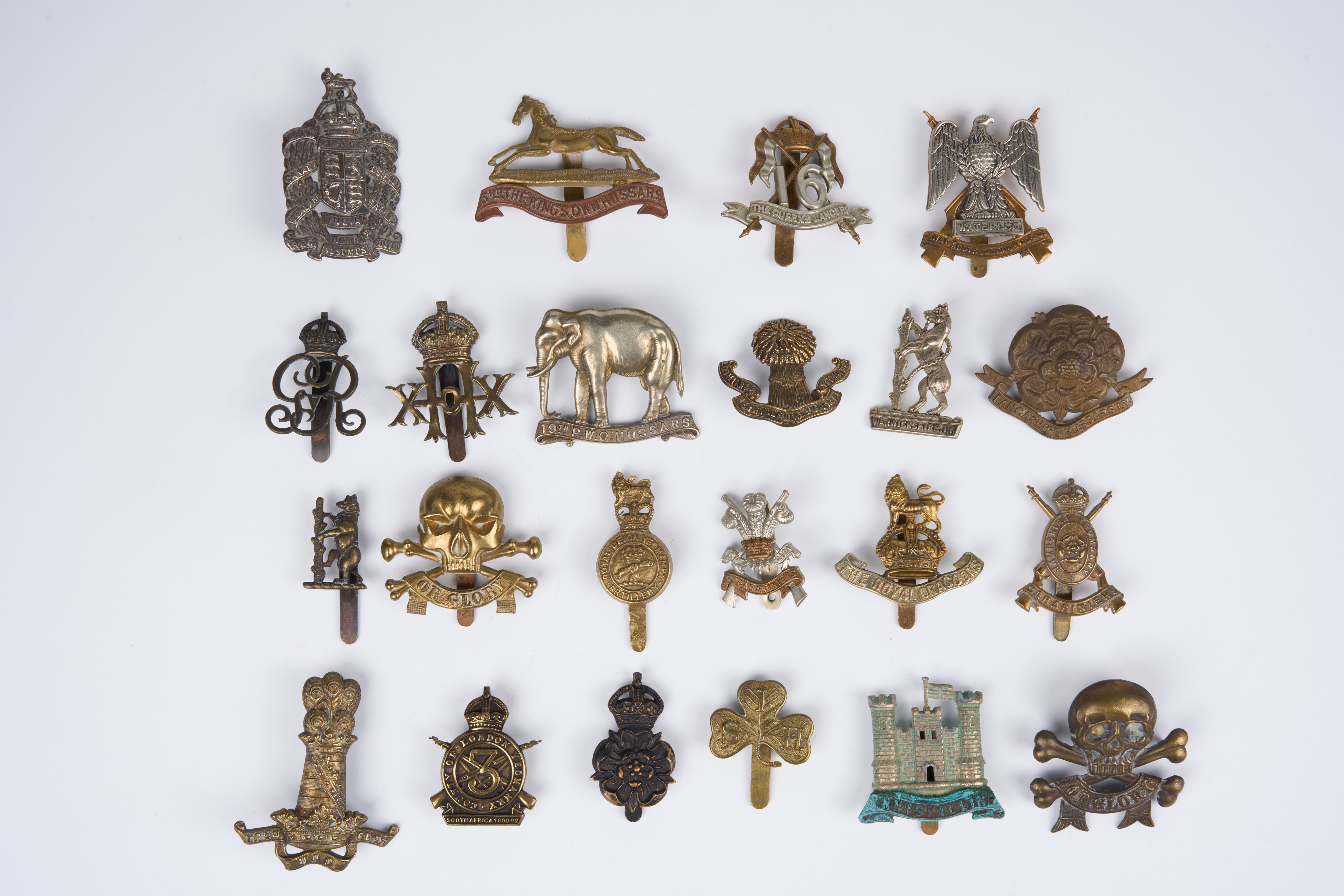 23 British and Commonwealth cap badges, loose in envelope