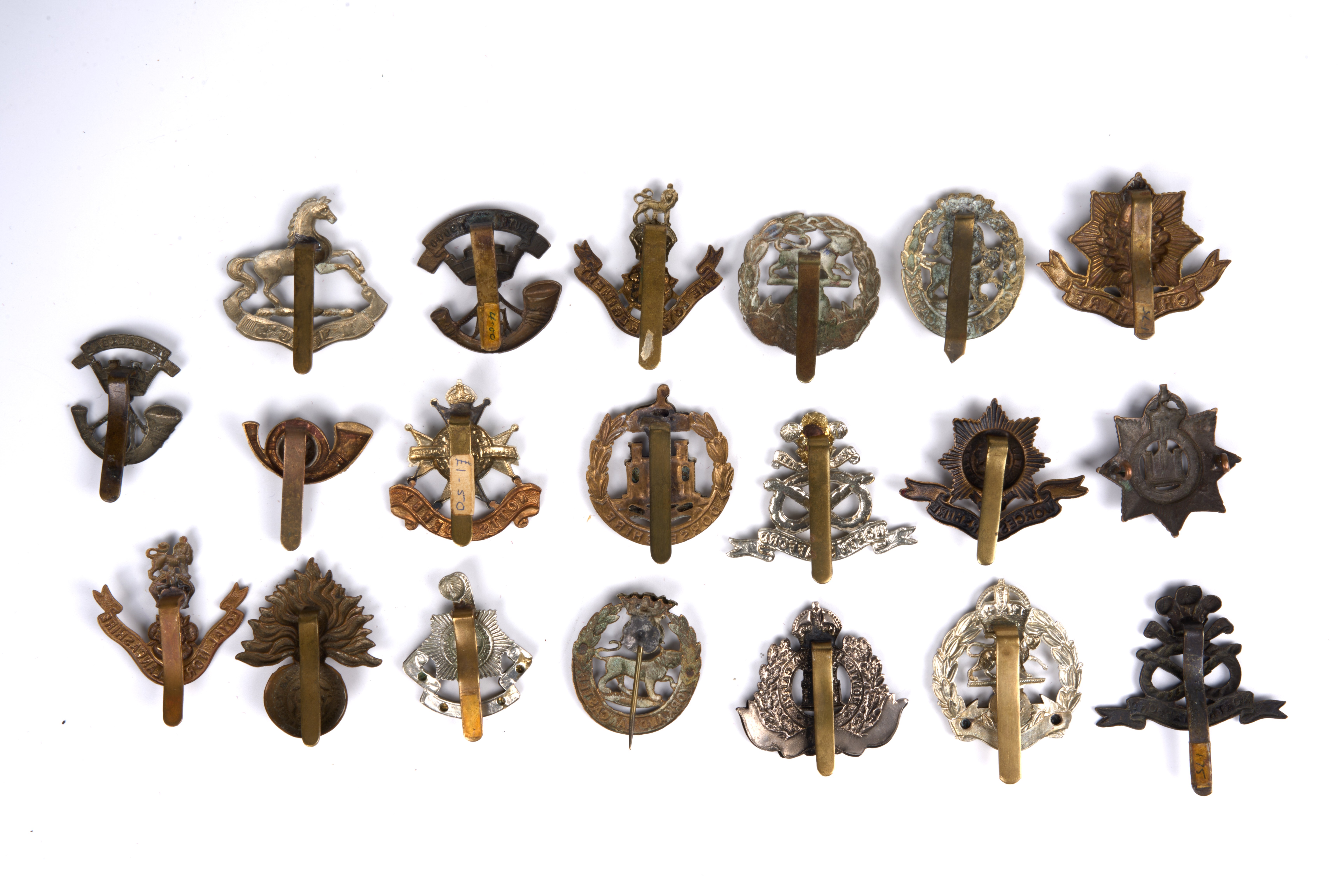 20 British and Commonwealth cap badges, loose in envelope