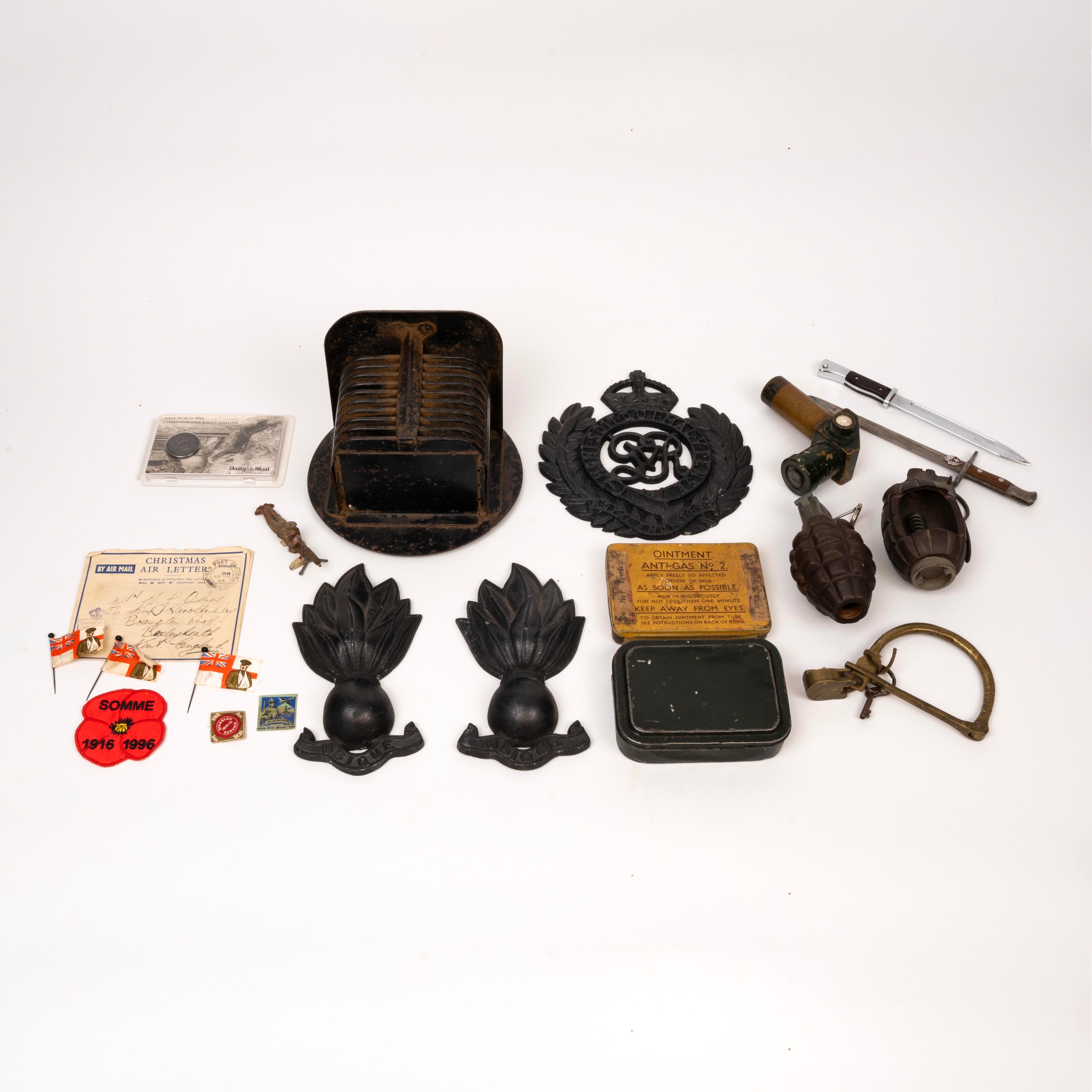 Various items, including Cutaway Mills Bomb, American Mk2 Grenade (Pineapple grenade), 0.303 no.4 Lee Enfield rifle ...