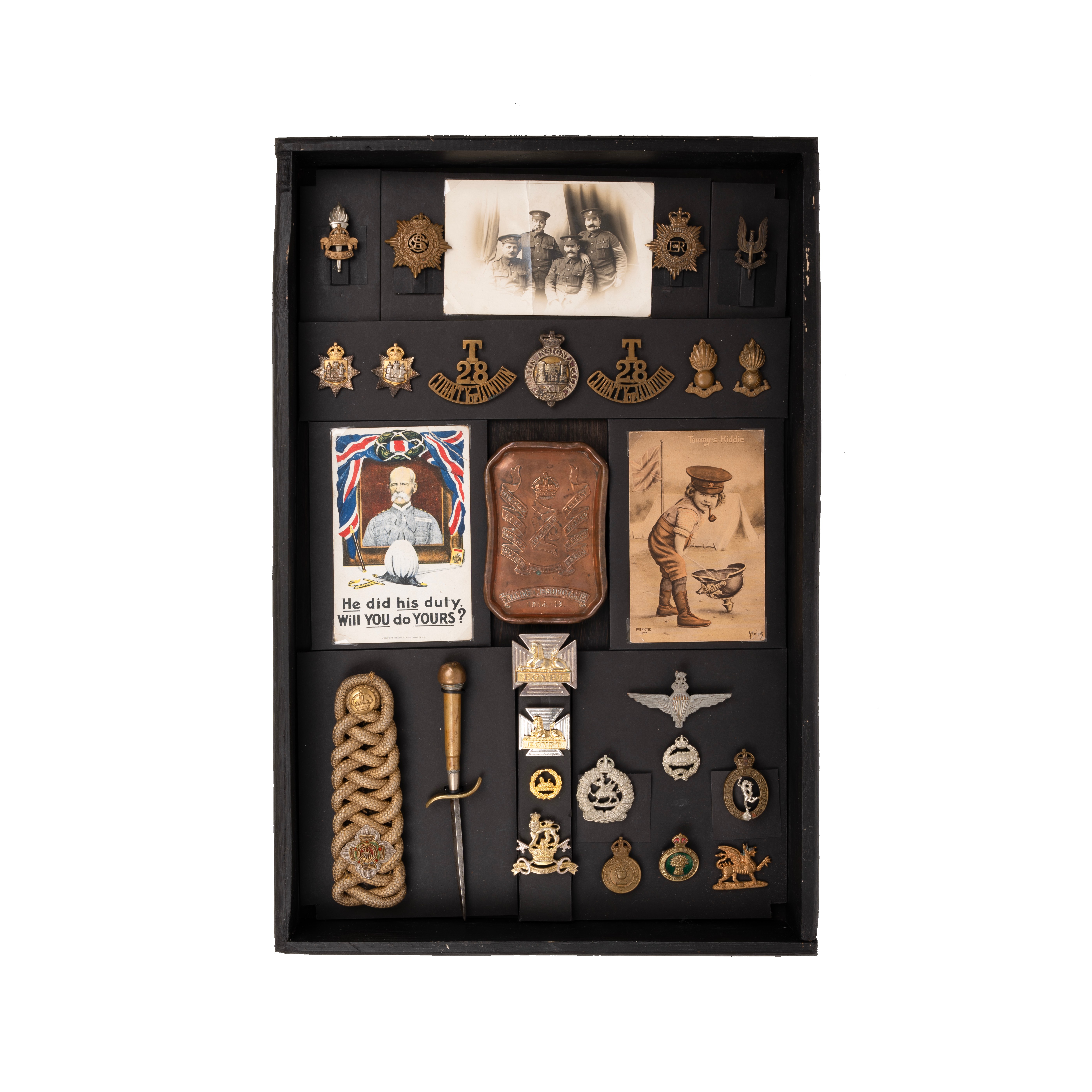 Tray of military badges, as seen, housed in display box 