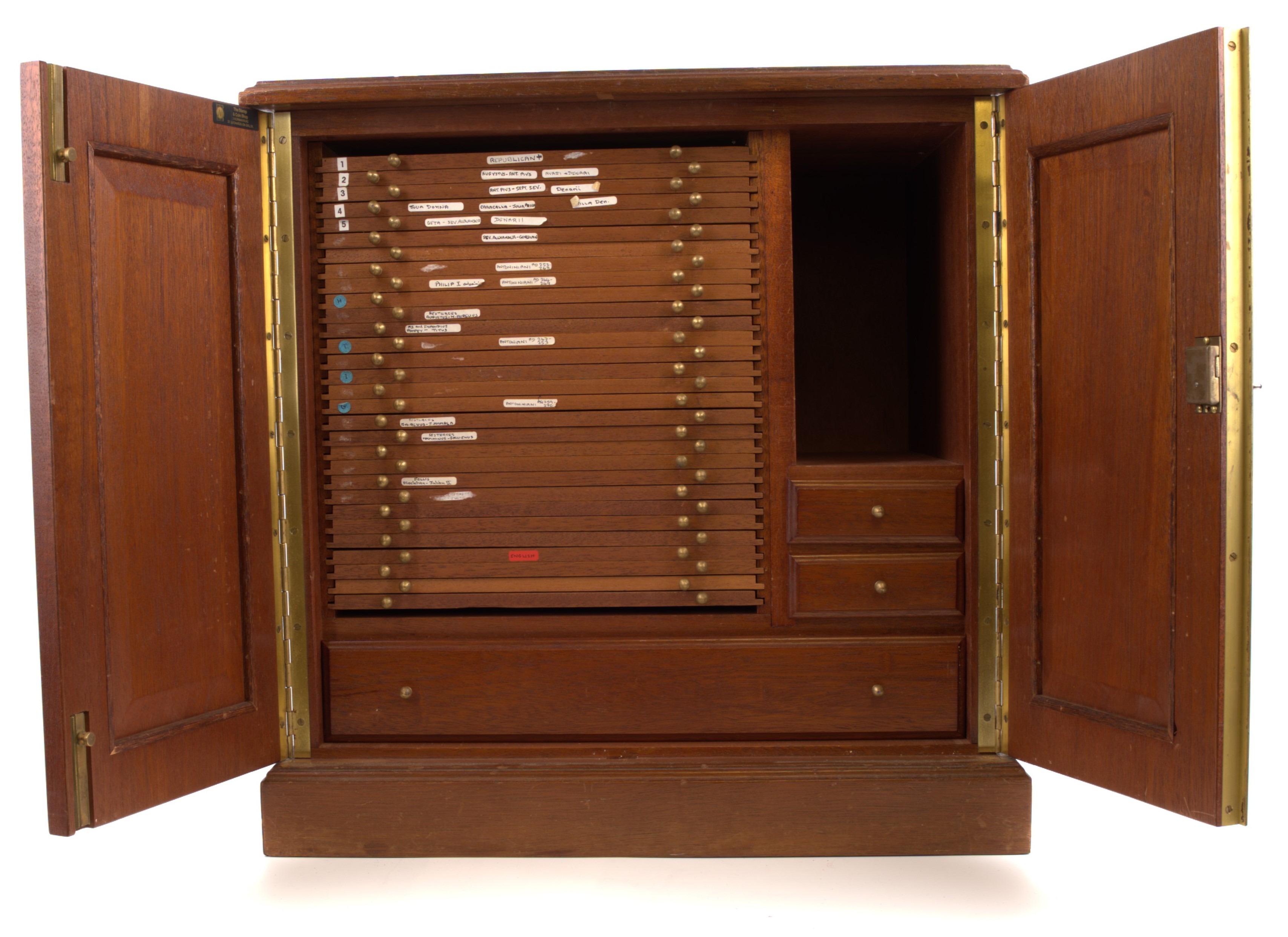 A modern wooden coin cabinet by St Leonards, 45 x 32 x 47cm., comprising 30 trays single-pierced to house a total of 1,2 …