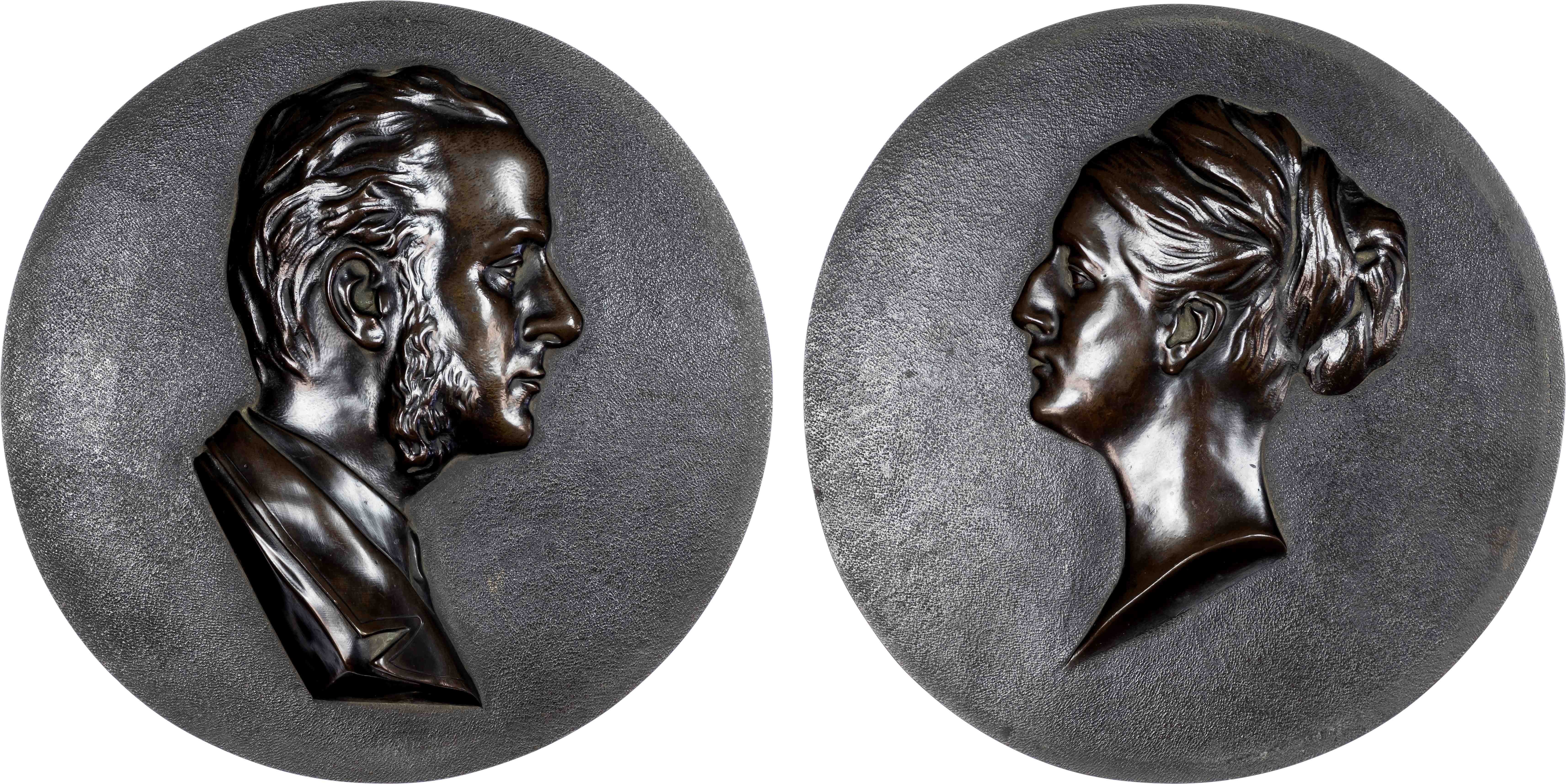 A pair of Victorian husband and wife uniface bronze plaquettes