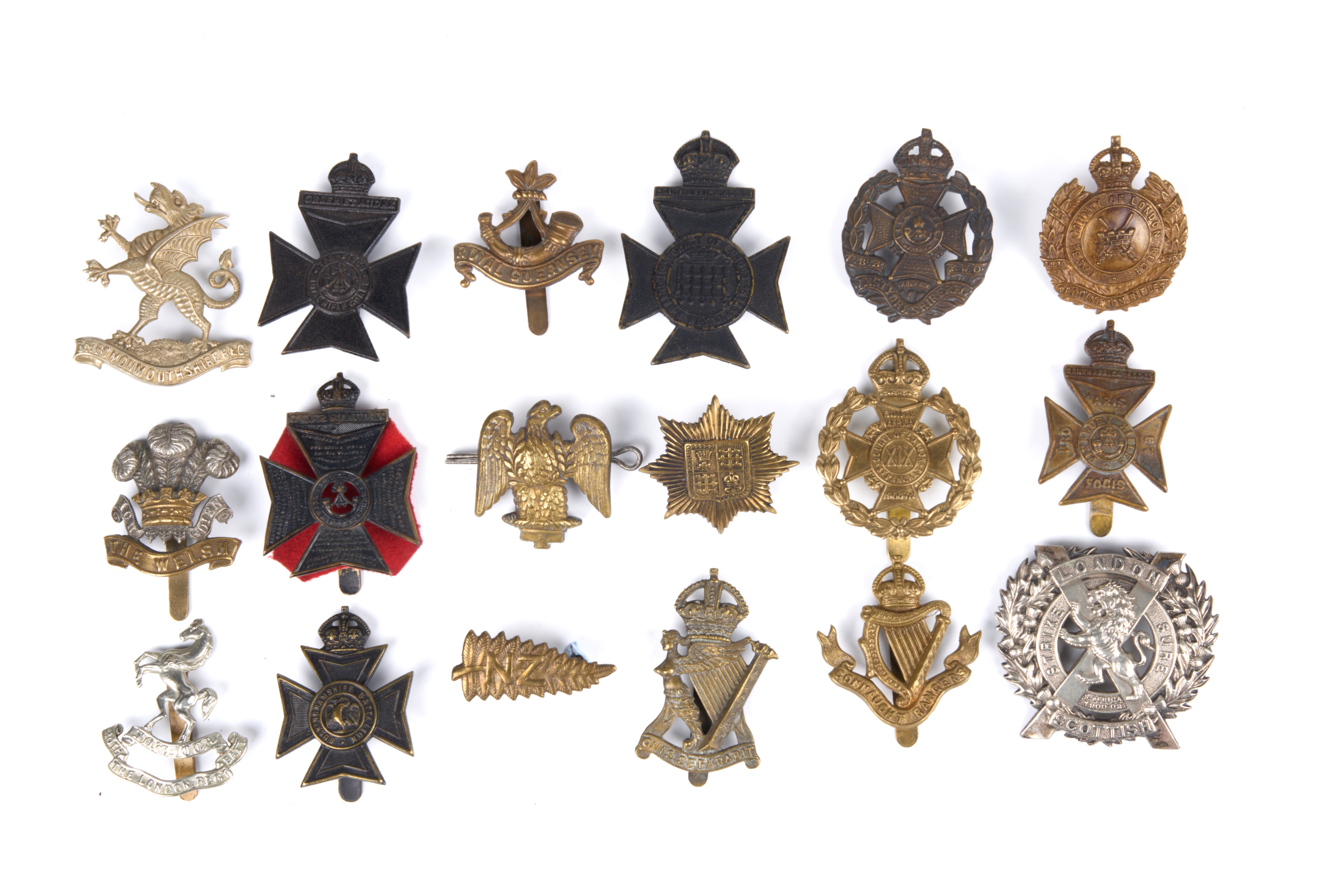 18 British and Commonwealth cap badges, loose in envelope