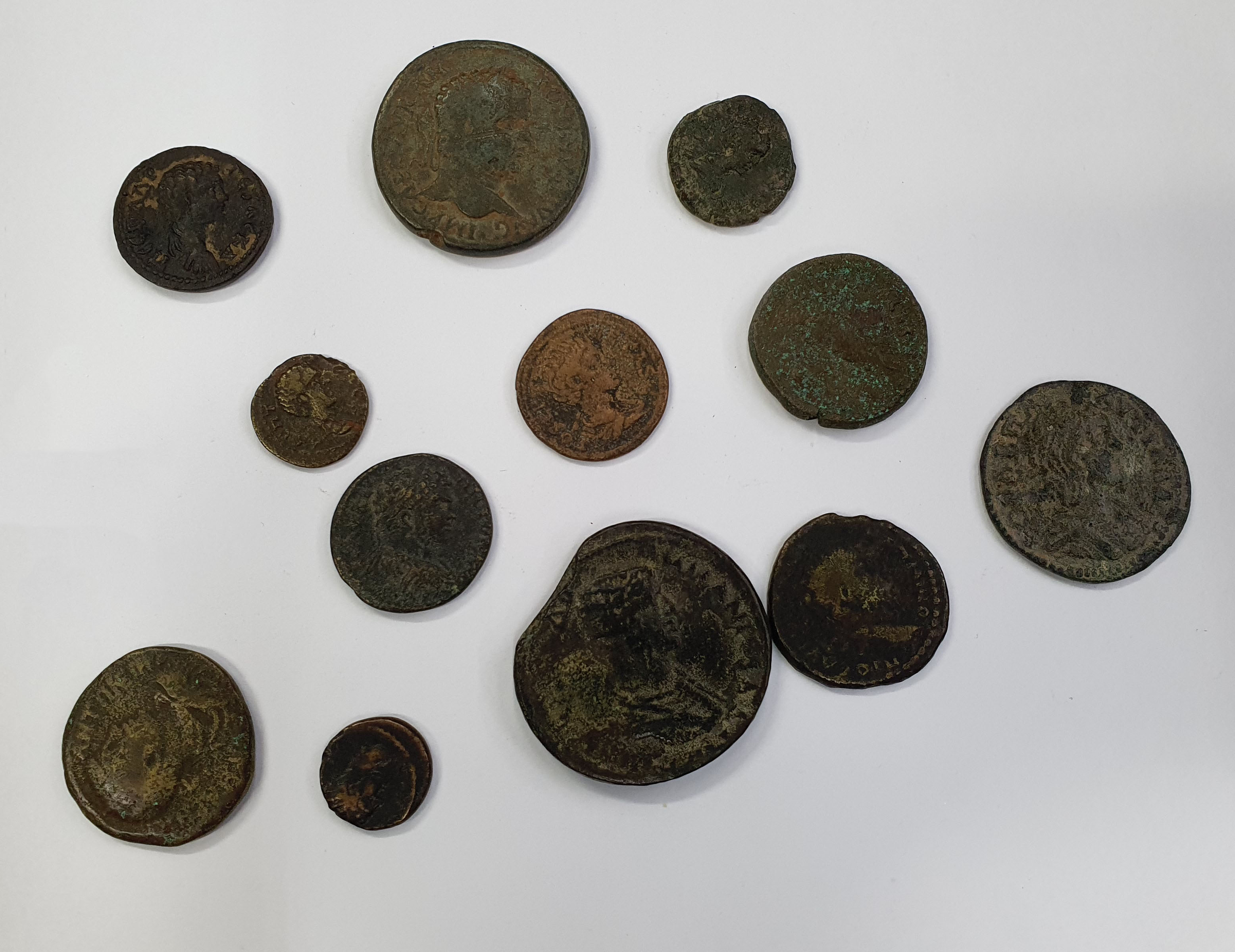 Group of 12 Caracalla and Geta provincial AEs. Various mints and types. 