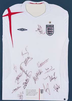 A white England football jersey signed by the touring squad to USA and Colombia in May 2005, mounted with a COA issued by the Football Association, si