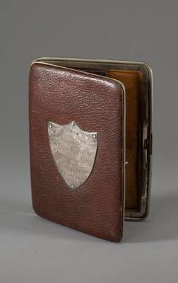 Silver crested wallet presented to F.W. Merryweather by Rotherham Football Club,
 the metal mounted brown leather wallet set with a silver shield shap