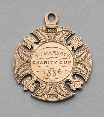 An early Scottish football medal awarded to Alex Higgins of Kilmarnock FC for the Kilmarnock Charity Cup in 1886,
 10ct. gold, fully inscribed with co