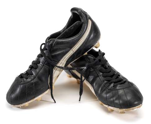 Diego Maradona Argentina Puma black match worn boots, circa 1986,
 black leather boots with Puma white side strip and silvered lettered PUMA, size 8, 