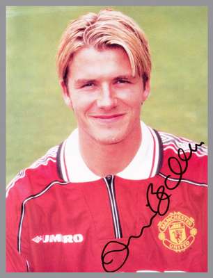 Signed colour photograph of Manchester United legend David Beckham, signed in marker pen, 10 by 8in. mounted, framed & glazed , 38.5 by 34cm.