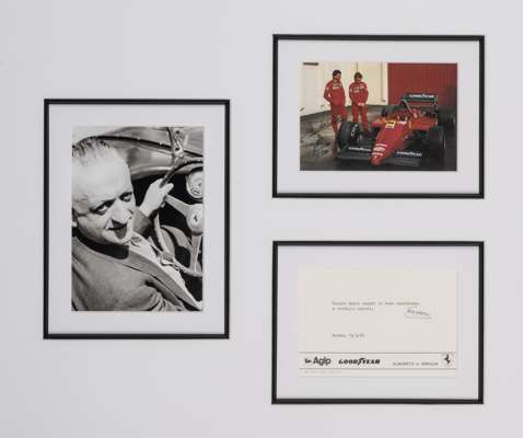 Enzo Ferrari signed compliment slip display, 
 featuring a printed colour image of Enzo Ferrari with a F1 car flanked by a b&w image of Enzo Ferrari a