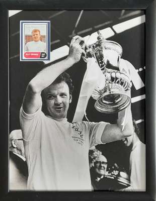 Billy Bremner Leeds United captain signed and framed A & BC football collectors card within an iconic image of Billy celebrating in the back of the ne