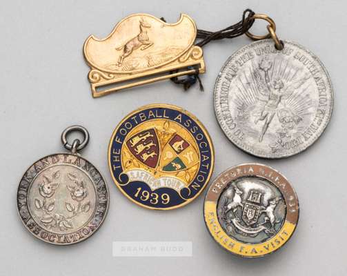 Group of four badges awarded to the F.A. official H. H. Hughes and relating to the tour of South Africa in 1939,
 the first issued by the Football Ass