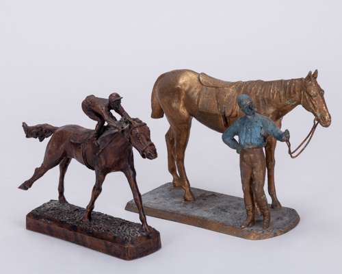 Three metalware racehorses and jockeys