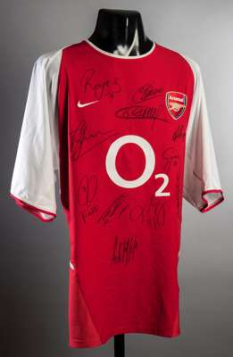 Arsenal 2003-04 replica home jersey signed by the 'Invincibles', 11 signatures in black marker pen including Reyes, Edu, Henry, Bergkamp, Wenger, Cyga