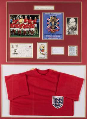 England "Champions of the World" 1966 display,
 comprising 7 by 9.5in. colour photograph of the England team with Bobby Moore holding the Jules Rimet 