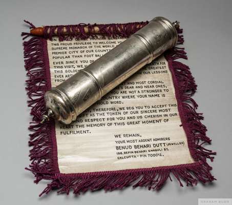 A tribute presented to Pelé composed of a cylindrical silverplated scroll box 
 engraved with the following inscription: "Mohun Bagan vs. Cosmos - 24 