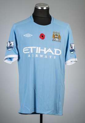 Carlos Tevez blue Manchester City no.32 Poppy home jersey v Birmingham City, played at City of Manchester Stadium, 13th November 2010,
 Umbro, short-s