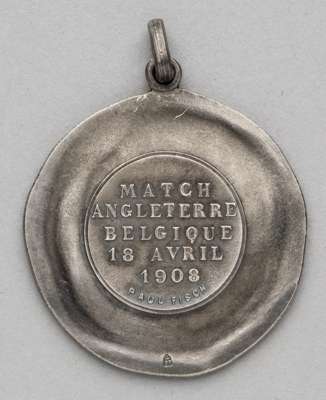 Memorabilia relating to Charles James Hughes and Harry Halmshaw Hughes,
 a silver medal awarded to F.A. official Charles James Hughes (1853-1916) on t