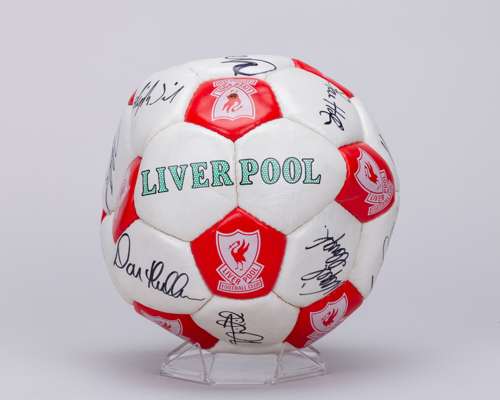 A red and white Liverpool autographed football