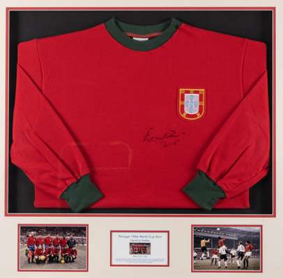 Eusebio signed Portugal World Cup 1966 retro jersey display,
 comprising red jersey with national emblem badge, signed in black marker pen, mounted ab