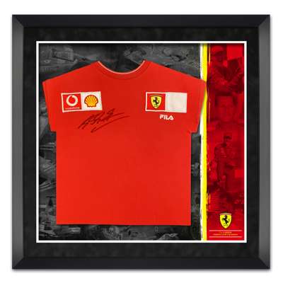 Formula 1 Michael Schumacher seven times World Champion signed & framed Ferrari shirt, 
 set upon mountboard with images and text befitting of a world