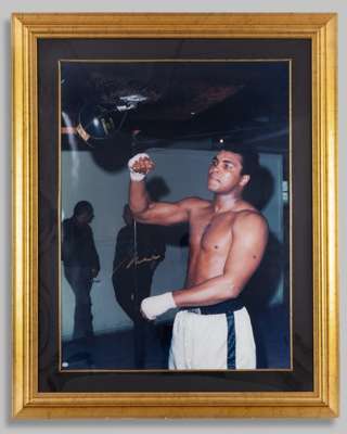 A large colour signed photograph of Muhammad Ali