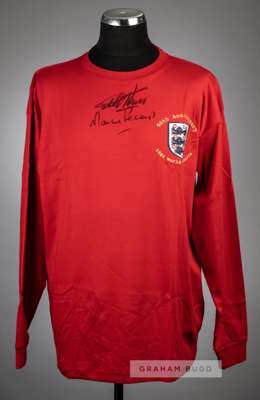Geoff Hurst & Martin Peters signed red 50th anniversary 1966 England World Cup Winners commemorative jersey,
 signed in black marker pen on front, wit