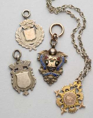 Two Football medals awarded to Workington AFC's H. Steel[e]?,
 the first engraved with crest and inscribed obverse WORKINGTON TOWN CHAMPIONSHIP, rever