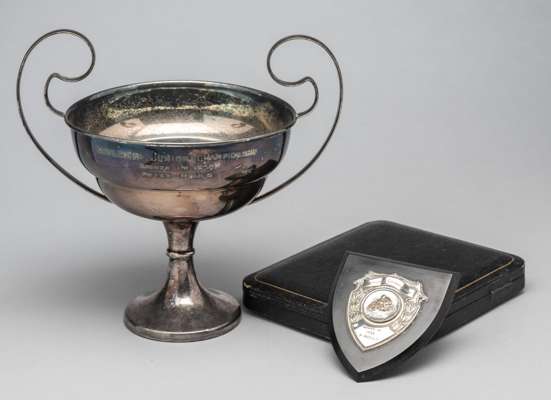 Two runner-up trophies awarded to Peter Mould, British speedway driver,
 comprising twin handled silver-plated trophy, engraved RAYLEIGH JUNIOR CHAMPI