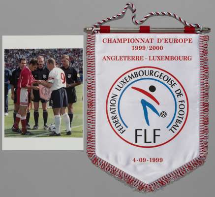 Pennant from the Euro 2000 qualifying match between England and Luxemburg presented to Captain Alan Shearer by Marc Birsens,
 prior to the game which 