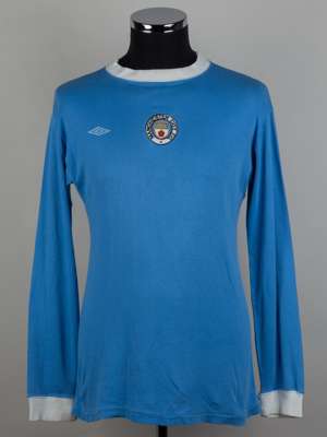 Tommy Booth sky-blue and white No.5 Manchester City long-sleeved shirt, 1975.